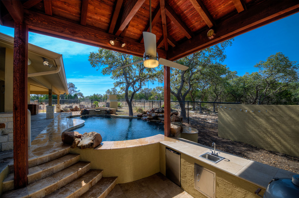 Pool with Sunk in Kitchen and water features