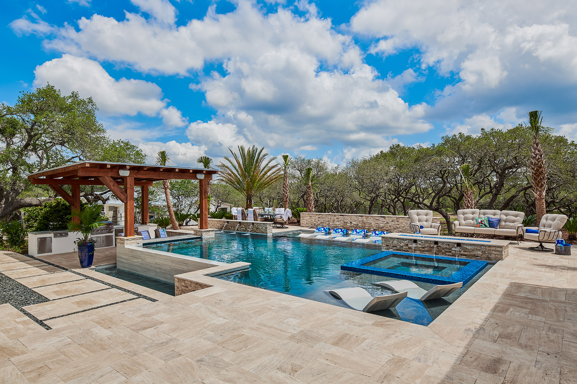 custom pool with travertine pavers