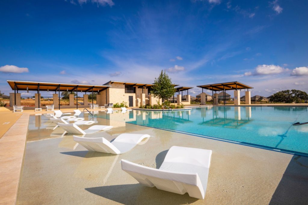 lounge poolside at the Veramendi Pool at The Ledge